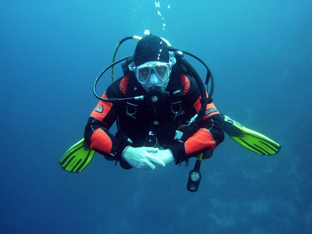 scuba diving in japan a man in a diving suit is holding on to a scuba pole